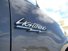 Featuring the factory style chrome lettering with black background, this emblem provides the correct identification of your svt lightning. F 150 Svt Lightning Fender Emblem 99 04 Lmr Com