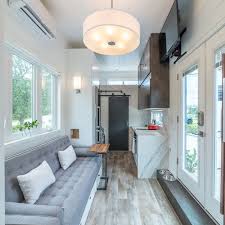 Some of the features that would work well in any tiny house are the sofa wall bed, the rising coffee table, and pocket chairs. 265 Sq Ft Boehm Is A Loft Free Modern Tiny House