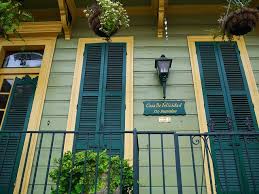 These homeowners chose a newly replaced yellow stucco for the exterior color, which was a great choice for a spanish style home. Green House Yellow Trim Yellow House Exterior Green Exterior House Colors Exterior House Colors