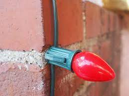 Usually, each clip has two small hooks in front of which you can hang the lights. How To Use Hot Glue To Fasten Christmas Lights To Brick Or Stucco