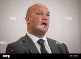 In this Feb. 12, 2016 photo, Casey Urlacher, an Illinois Senate 26th  District Republican primary candidate, meets with the Chicago Sun-Times  Editorial Board in Chicago. Urlacher, the brother of Chicago Bears Hall