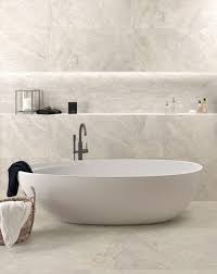 For modern open plan kitchens neutral, white, grey or black large kitchen floor tiles continue to be in high demand. Flint Light Grey Porcelain Tile Mandarin Stone