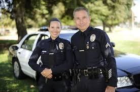 Tired Old Cop The Officer Sees A Dad With Daughter In Tow He Raises His Hand To Gesture Hello Police Officer Costume Police Officer Female Police Officers