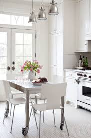 A stainless steel kitchen cart will bring both practical storage and trendy design to your kitchen. Kitchen Island Dining Table Contemporary Kitchen Bear Hill Interiors