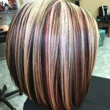 Placing the blonde shade at the tips makes the ends seem thicker allowing heavily textured tips to create a spiky, edgy texture! Light Brown Hair With Mahogany Highlights Novocom Top