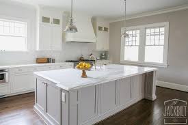 Going into 2021, wood stained kitchen cabinets will still be popular in more traditional kitchens. White Kitchen With Grey Island Transitional Kitchen