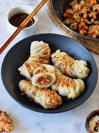 These Asian Inspired Vegan Cabbage Rolls Are Made Up Of Tender Cabbage Leaves Stuffed With Asian Vegetarian Recipes Vegan Cabbage Rolls Vegan Cabbage Recipes
