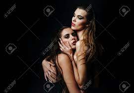 Sensual Women With Sexy Pose. Lesbian Couple Of Two Sexy Women Or Pretty  Girls Hugging On Balck Background. Homosexual Love And LGBT. Stock Photo,  Picture and Royalty Free Image. Image 167869387.