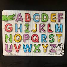 A colorful picture under each piece shows an image beginning with the same . Melissa Doug Toys Melissa Dough Alphabet Puzzle Poshmark