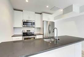 white kitchen cabinets with dark