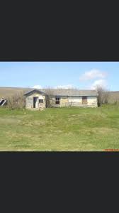Hello everyone! I'm new here. This is my great grandparents home. This is  located outside of North Battleford. The gentleman in the photos is my  grandad, he grew up in this house