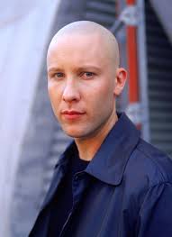 D3 Skinny man with shaved head mistaken