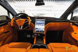 orange and the all black meet t sportline s widebody tesla model x carscoops tesla suv tesla model x tesla model