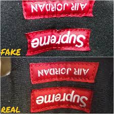 Fake vs real supreme box logo crewneck neck tag. How To Tell If Your White Supreme Air Jordan 5s Are Real Or Fake Sole Collector