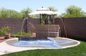 Splash pads are one of the most practical play solutions for summer days. Residential Arizona Splash Pads Arizona Backyard Backyard Splash Pad Backyard Playground
