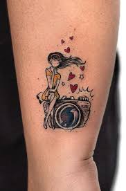 Bite The Bullet Tattoo Meaning Photographer Girl Tattoo Inkstylemag Camera Tattoos Tattoo Artists Girl Tattoos