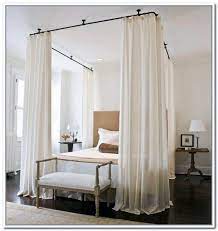 Instead, this diy bed canopy uses a wooden dowel inserted through the casing to create a straight curtain, which is thumbtacked to the ceiling to hang over the the chains help to shape the canopy so it frames part of the bed. 14 Diy Canopies You Need To Make For Your Bedroom Canopy Bed Curtains Canopy Bed Frame Canopy Bed Diy