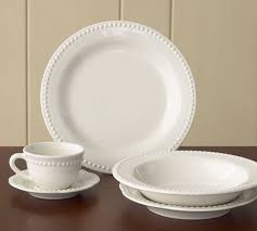 These white porcelain dishes feature a subtle beaded accent around their edges for a pop of texture. Emma Beaded Stoneware Dinnerware Sets In 2021 White Dinnerware Dinnerware Pottery White Pottery