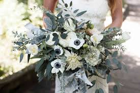 Bows & arrows flowers created this textured bouquet paired roses, dahlias, and peonies in white and pink, all tied with a piece of fabric from her mother's wedding gown. Inspirational And Elegant White Bridal Bouquets