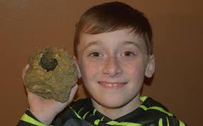 Five-year-old finds rock with sun and moon