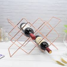 Countertop wine bottle storage rack with decorative grapevine design and durable metal construct. China Metal Wine Rack Countertop Free Stand Wine Storage Holder On Global Sources Eco Friendly Wine Racks Stainless Steel Wine Racks