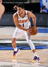 Kendall jenner and basketball player devin booker have been together for about a year, but they've kept things pretty low key for the most part. Kendall Jenner Shows Off Her Toned Abs While Wearing Beau Devin Booker S Phoenix Suns Jersey Daily Mail Online