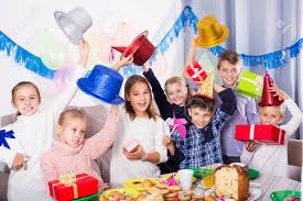 So you've been invited to a dinner party and the inevitable question looms: Smiling Children Giving Gifts To Each Other During Dinner Party Stock Photo Picture And Royalty Free Image Image 102298296