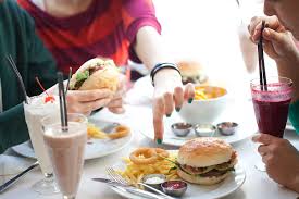 People Eating Fast Food Served In A Restaurant By Mosuno Stocksy United Which foods from your country do most foreign people enjoy? people eating fast food served in a