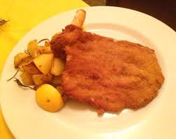 It is traditionally fried with butter and is often. Cotoletta Alla Milanese Con Patate Al Forno Picture Of Posto Di Conversazione Milan Tripadvisor