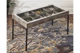 Seashell candles placed on the table make up a cool table runner with lights. Shellmond Coffee Table With Display Case Ashley Furniture Homestore