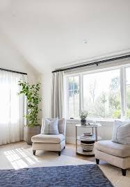 Bedroom Sitting Area With Two Accent Chairs Custom Draperies With Stark Casamance Azur Fabric A Bedroom With Sitting Area Sitting Area Design Coastal Bedrooms