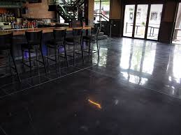 A Polished Concrete Floor With A Black Stain And White Decorative Joints Provides A Beautiful Concrete Floors Restaurant Design Inspiration Polished Concrete