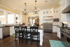 The white cabinets stands out well against the dark wengue flooring material used, and also has a subtle contrast against the creamy white walls. 45 Luxurious Kitchens With White Cabinets Ultimate Guide Designing Idea