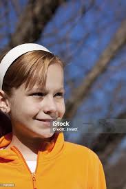 Smiling Caucasian Girl In The Autumn Sun Stock Photo