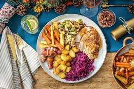 Child at family christmas dinner at home. Ultimate Christmas Dinner Guide With Hellofresh Claire Justine