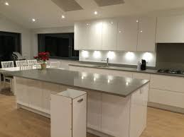 Kitchens have conventionally been used to prepare family meals, store food and organise utensils and crockery. White Gloss Kitchen With Grey Floor Novocom Top