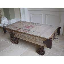 This antique style factory cart coffee table with reclaimed wood is an incredible piece. Large Industrial Railway Cart Style Coffee Table Flora Furniture