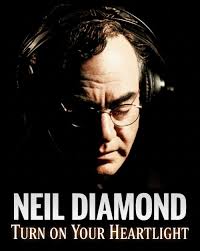 Let's listen to “Turn On Your Heartlight” by Neil Diamond, released in 1982 
