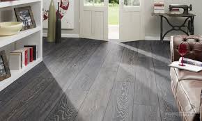Laminate flooring is a floating installation, meaning it isn't fastened to the subfloor by glue, nails or staples. Floor Small Room With Grey Laminate Flooring Below White Books Rack And Brown Furniture Leather Sofa Grey Laminate Flooring White Laminate Flooring Flooring