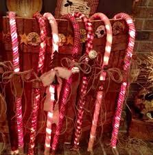 Primitive Candy Canes Large Light Up Candy Canes I Wrapped In Homespun Material And Added Rust Primitive Christmas Crafts Primitive Christmas Primitive Crafts