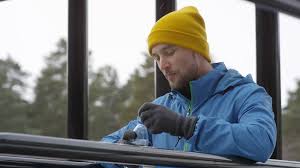 Lovepik provides 130000+ yellow knit hat photos in hd resolution that updates everyday, you can free download for both personal and commerical use. Handheld Shot Of Handsome Man In Yellow Beanie Hat And Blue Windbreaker Leaning On Dip Bars And Drinking Water From Bottle While Resting After Working Out At Outdoor Gym In Winter Stock