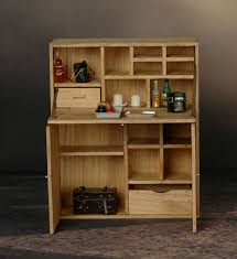 Bureau secrétaire en bois vintage composé d'une porte centrale qui fait office de bureau et de 2 portes dans la partie basse avec 1 étagère. Bureau Secretaire En Bois Machinegun