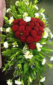 Flowers are one of the most common things to use in funeral services. Beautiful Red Roses In A Heart Shape Funeral Flower Arrangements Casket Flowers Funeral Floral