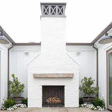 A beautiful accent piece to add to your stone project. White Brick Cococozy Brick Outdoor Fireplace Outdoor Fireplace Exterior Fireplace
