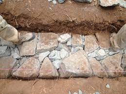 As the foundations are within the ground in confined situation, sand filled stone joints remain safe but also provide required cushioning to absorb seismic shocks. Building A Stone Foundation This Cob House