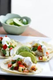 Mango, pineapple, cilantro, red onion and lime juice create the perfect tropical salsa to top your tacos! Tropical Fish Tacos With Pineapple Salsa Perry S Plate