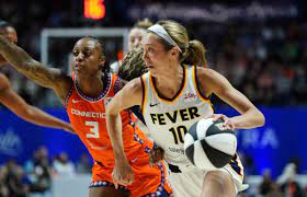 Indiana Fever guard Lexie Hull (10) drives the ball against Connecticut Sun  guard Tiffany Mitchell (3) in the second half at Mohegan Sun Arena. |  HoopsHype
