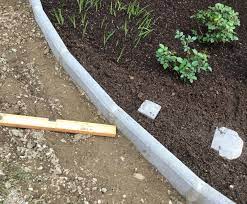 Gravel boards are a great way to protect wooden fences from moisture. Fitting Rockfaced Gravel Board As Lawn Edging Bbc Gardeners World Magazine