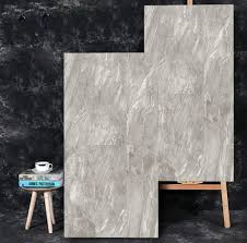 Two recessed niches in the corner are built into the tile accent and provide much needed storage. China Large Format Glaze Grey Rectangle 24x48 Tile Shower China Floor Tile Ceramic Porcelain Tile