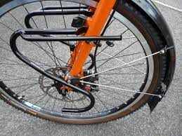 the tubus duo front rack 12 x 12 x 2 and thus has a chance of fitting within the travel bike box